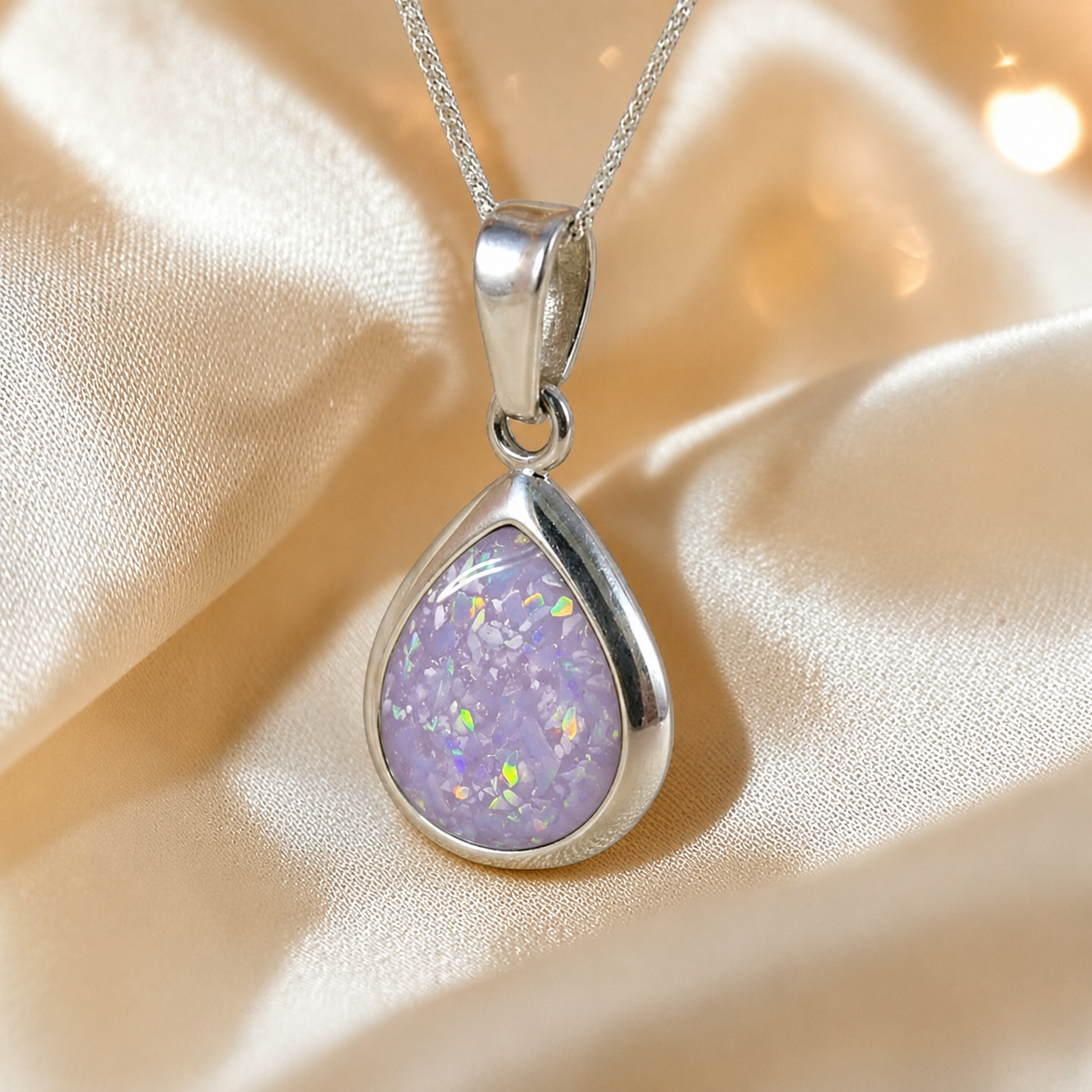 Procyon pear shaped ashes pendant in unicorn purple, handcrafted in Lancashire UK