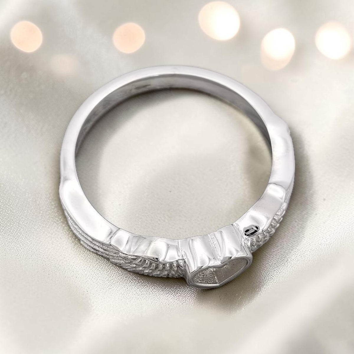 Raphaela Ring — top view of silver angel wing heart memorial ring, handcrafted in Lancashire, UK