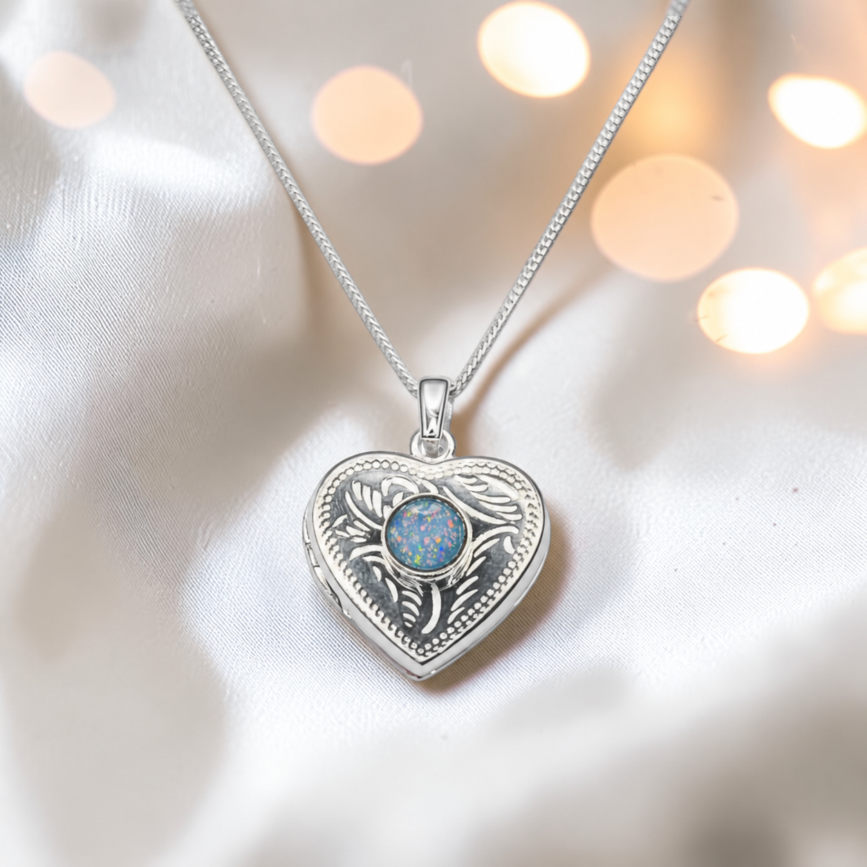 Rasal heart locket with round memorial stone in baby blue, handcrafted in Lancashire UK - by Keepsake Memorial Jewellery