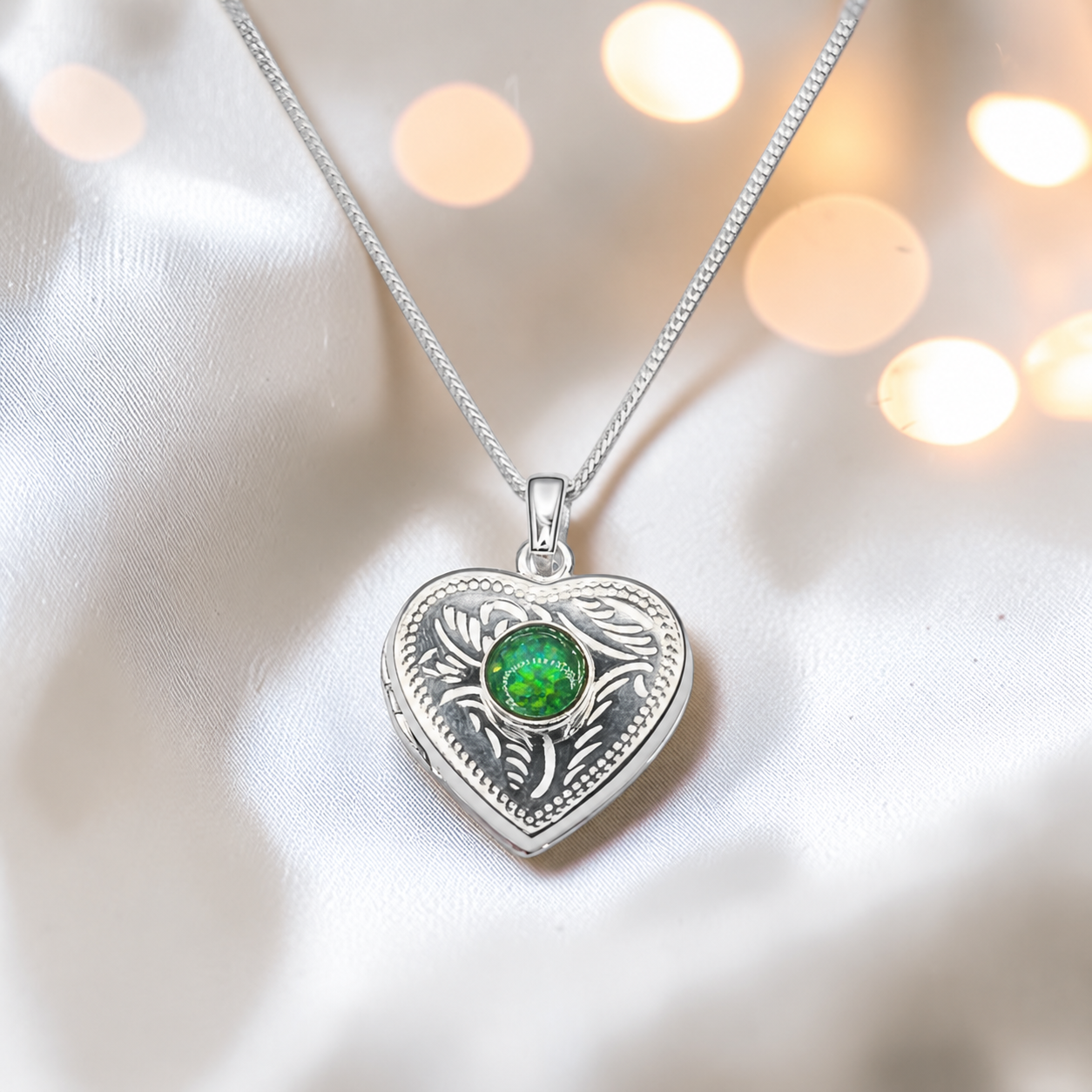 Rasal heart locket with round memorial stone in fruit green, handcrafted in Lancashire UK - by Keepsake Memorial Jewellery
