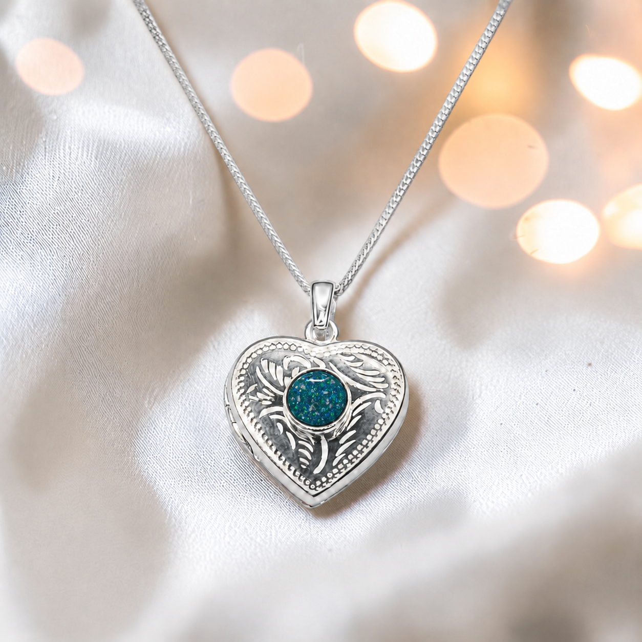 Rasal heart locket with round memorial stone in teal mist, handcrafted in Lancashire UK - by Keepsake Memorial Jewellery