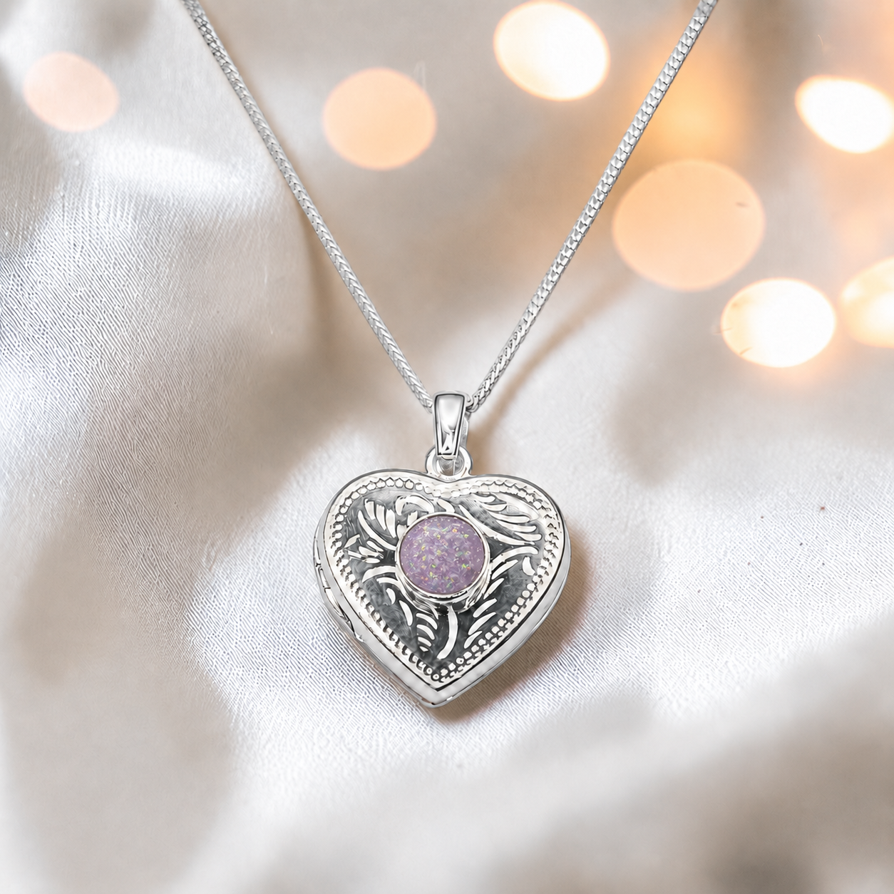 Rasal heart locket with round memorial stone in unicorn purple, handcrafted in Lancashire UK - by Keepsake Memorial Jewellery