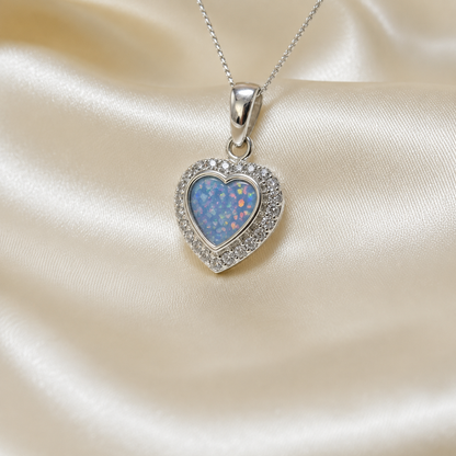 Rigel sterling silver heart ashes pendant with CZ stones, in baby blue, handcrafted in Lancashire UK 