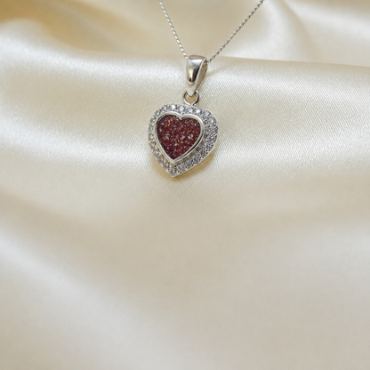 Rigel sterling silver heart ashes pendant with CZ stones, in ruby red, handcrafted in Lancashire UK 