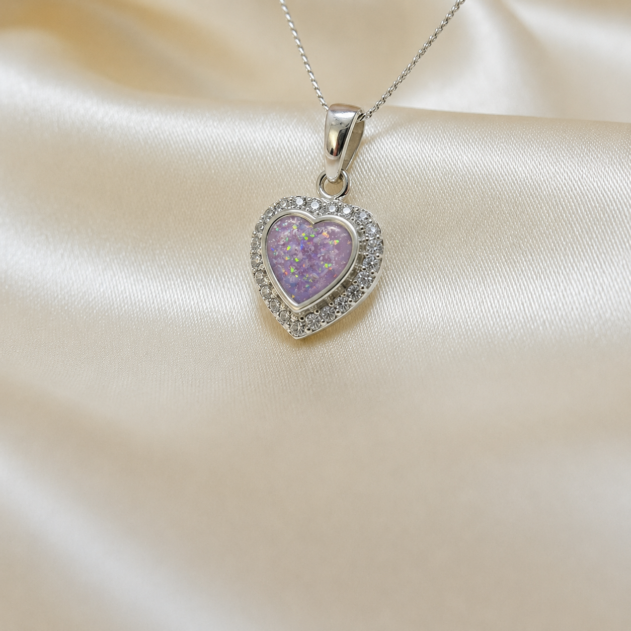 Rigel sterling silver heart ashes pendant with CZ stones, in unicorn purple, handcrafted in Lancashire UK 