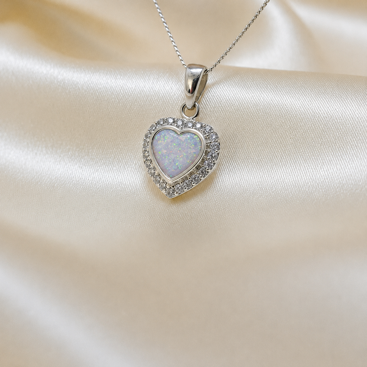 Rigel sterling silver heart ashes pendant with CZ stones, in white snow, handcrafted in Lancashire UK 