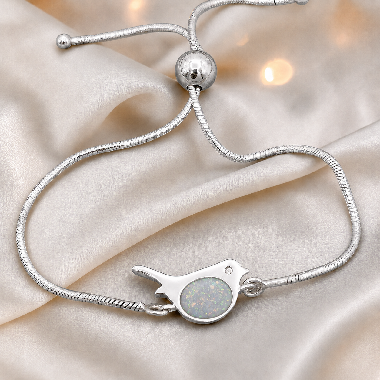 Robin bird memorial ashes bracelet, in white snow, handcrafted in Lancashire UK - by Keepsake Memorial Jewellery