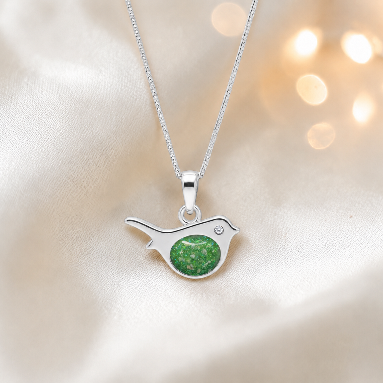 Robin bird shaped white gold memorial pendant in fruit green, handcrafted in Lancashire UK - by Keepsake Memorial Jewellery