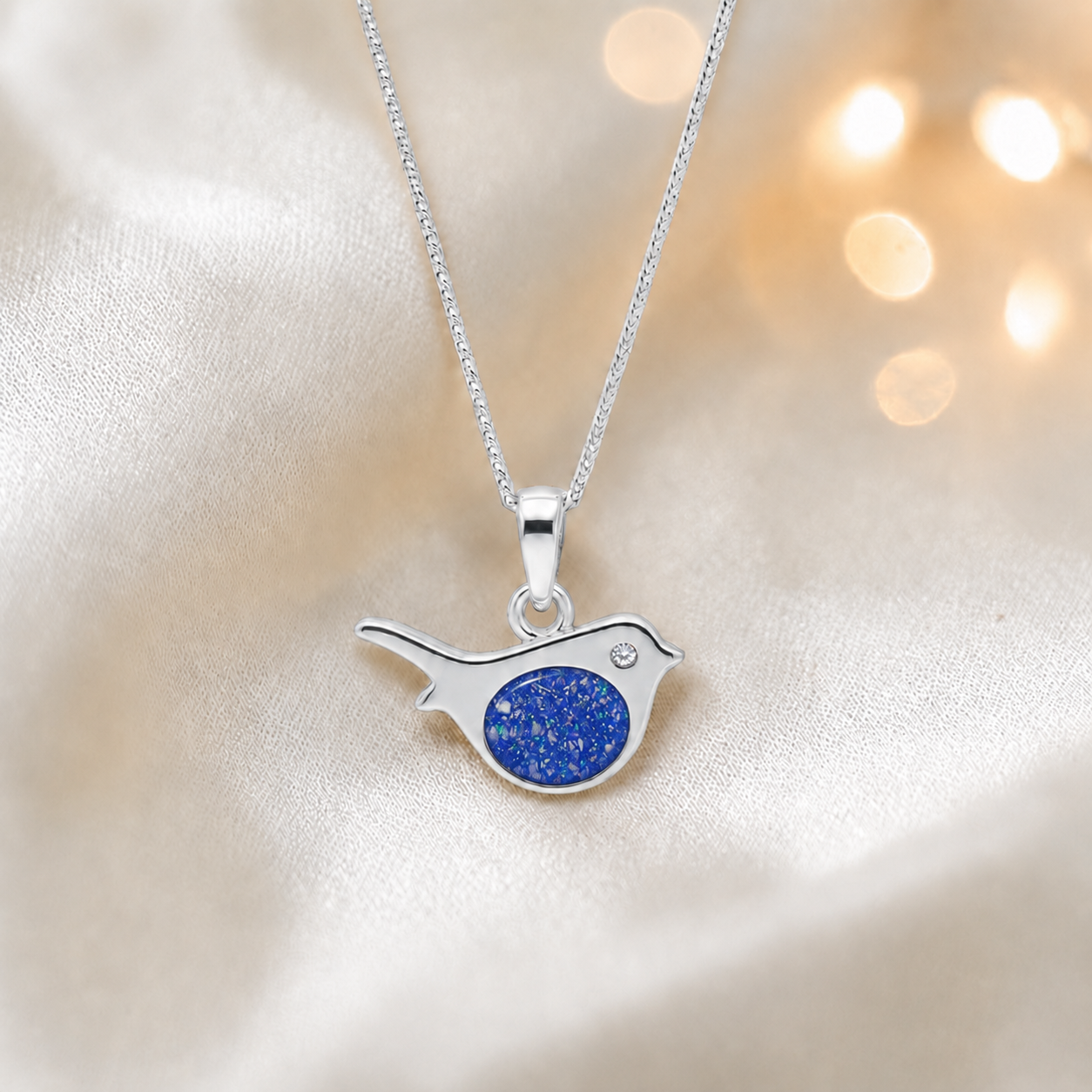 Robin bird shaped white gold memorial pendant in royal blue, handcrafted in Lancashire UK - by Keepsake Memorial Jewellery