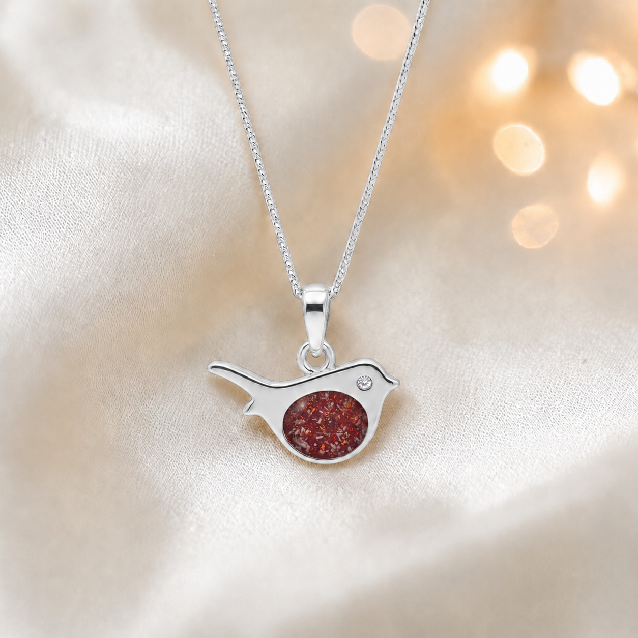 Robin bird shaped white gold memorial pendant in ruby red, handcrafted in Lancashire UK - by Keepsake Memorial Jewellery