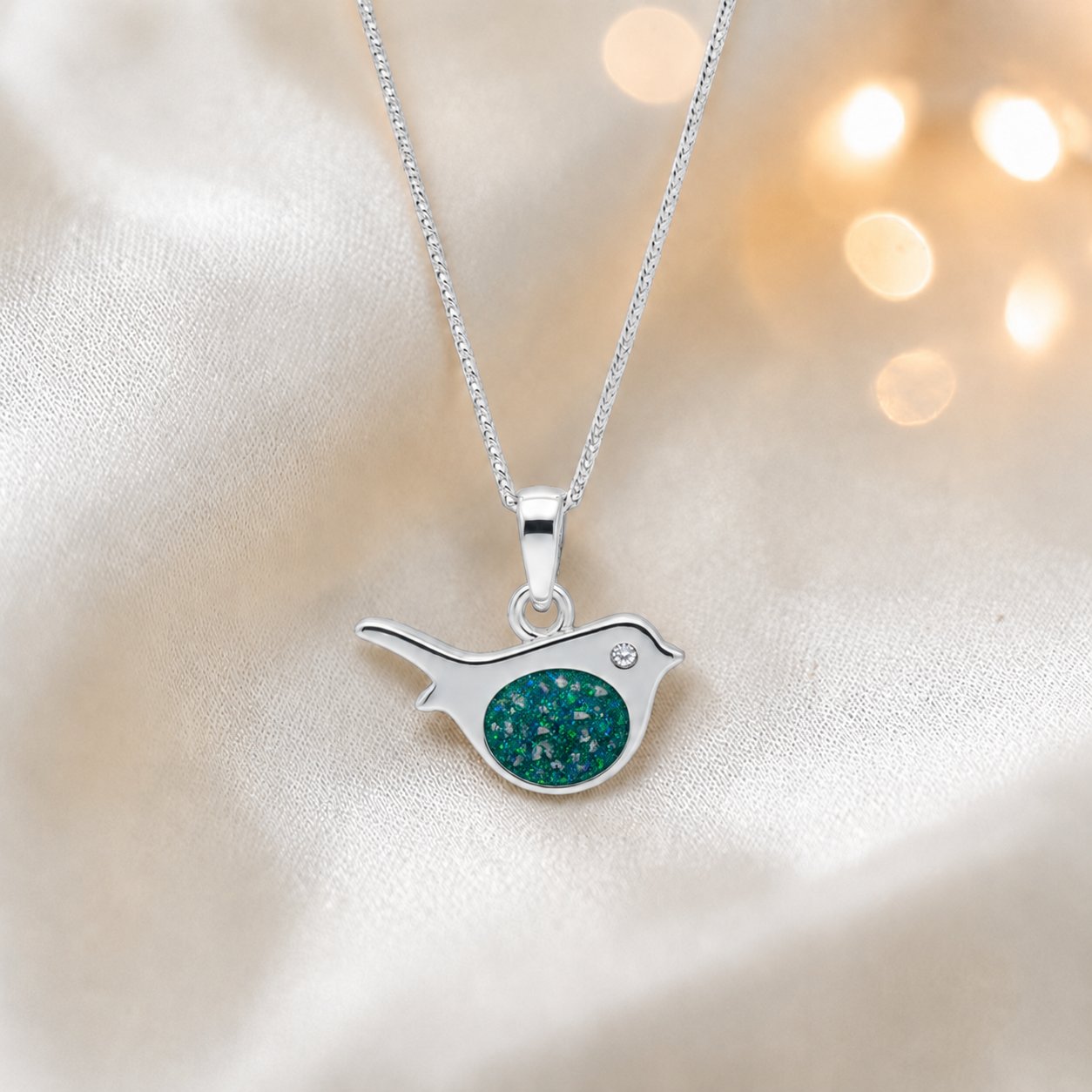 Robin bird shaped white gold memorial pendant in teal mist, handcrafted in Lancashire UK - by Keepsake Memorial Jewellery