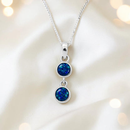 Sadr two stone memorial pendant in sapphire glow, handcrafted in Lancashire UK - by Keepsake Memorial Jewellery