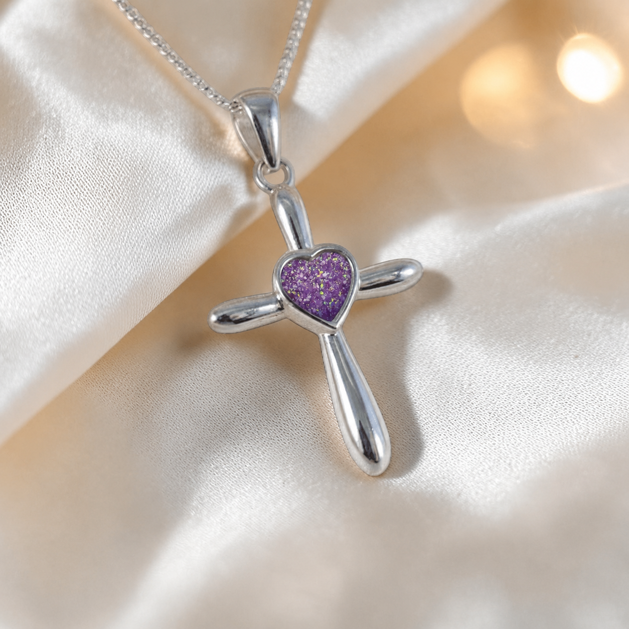 Saiph dainty sterling silver ashes cross with heart detail in rose pink, handcrafted in Lancashire UK - by Keepsake Memorial Jewellery  