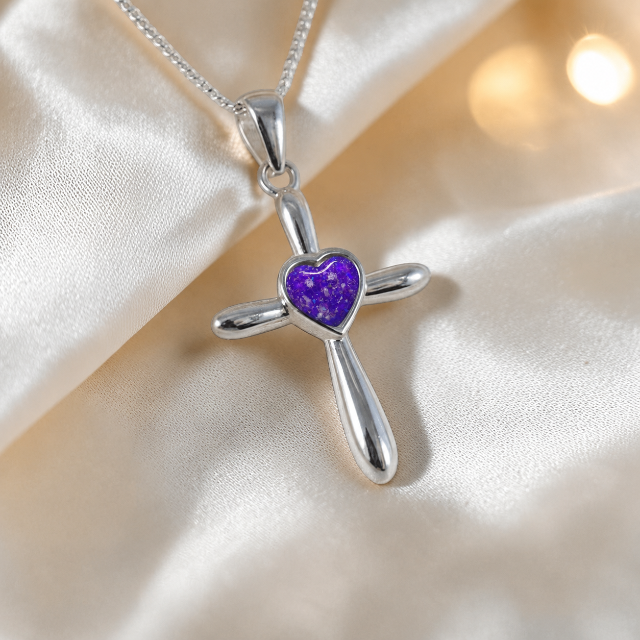 Saiph dainty sterling silver ashes cross with heart detail in sleepy lavender, handcrafted in Lancashire UK - by Keepsake Memorial Jewellery  