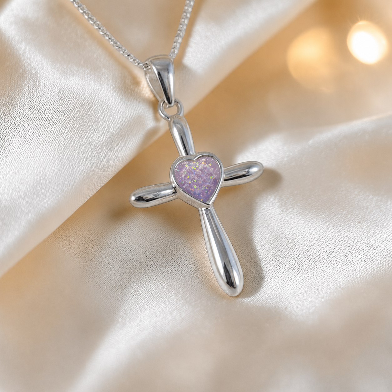 Saiph dainty sterling silver ashes cross with heart detail in unicorn purple, handcrafted in Lancashire UK - by Keepsake Memorial Jewellery  