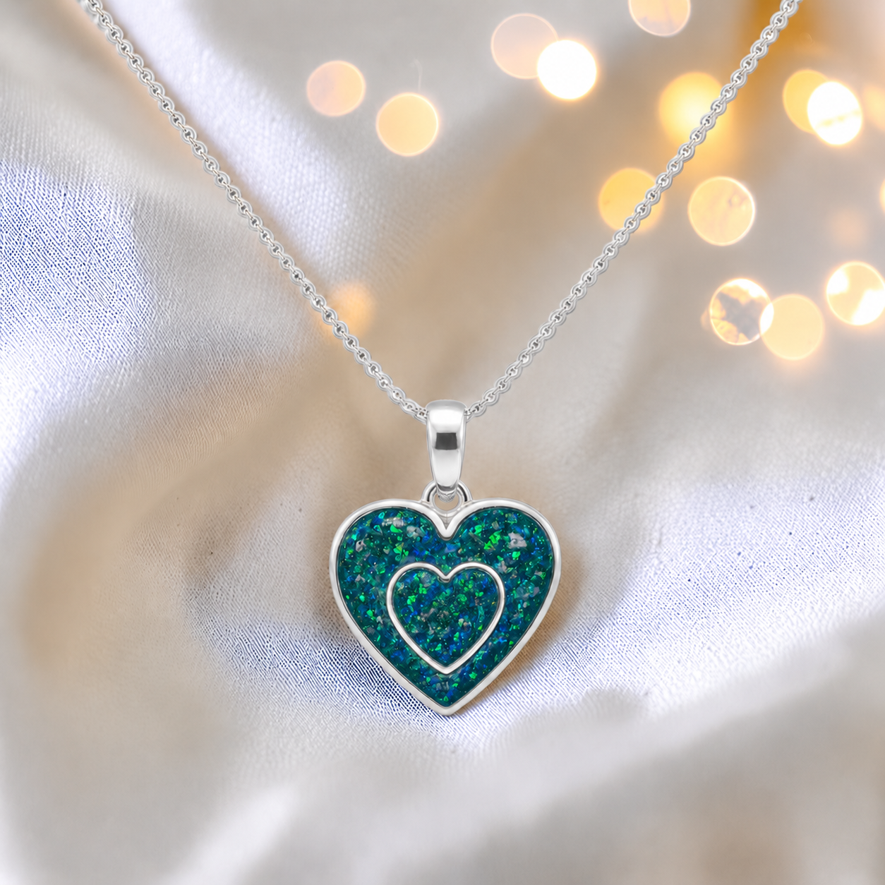 Shaula two heart memorial pendant in teal mist, handcrafted in Lancashire UK - by Keepsake Memorial Jewellery
