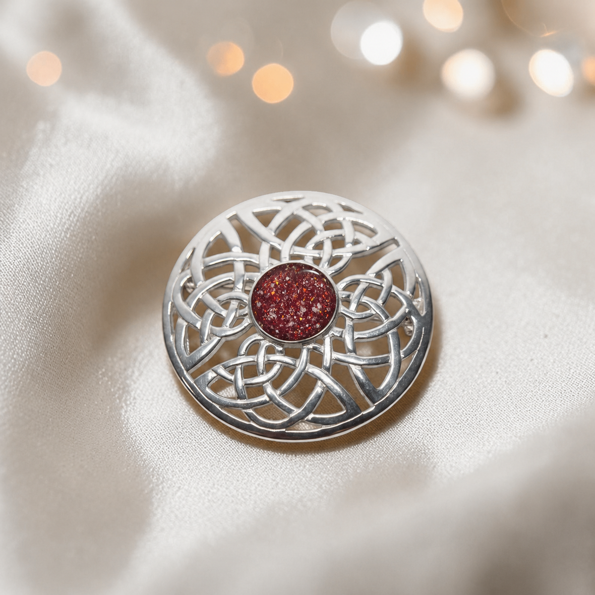 Skye brooch - sterling silver Celtic ashes memorial brooch in ruby red, handcrafted in Lancashire UK - by Keepsake Memorial Jewellery
