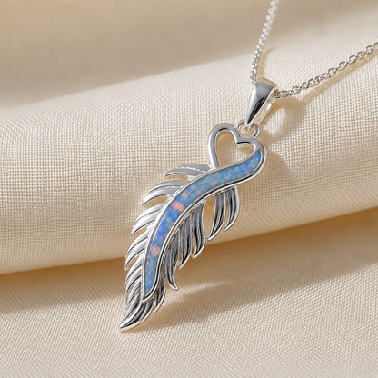 Spica feather memorial pendant in baby blue, handcrafted in Lancashire UK