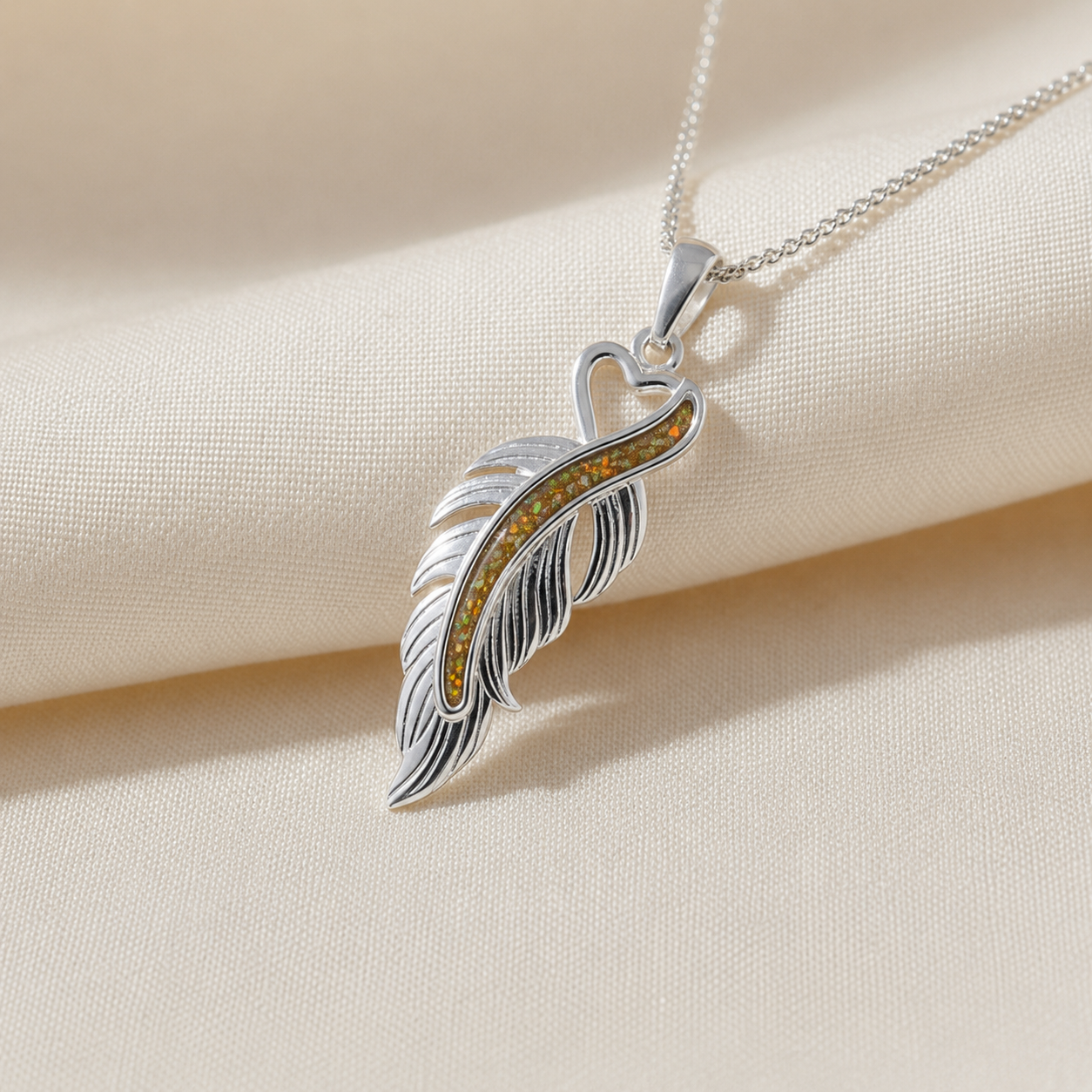 Spica feather memorial pendant in gold olive, handcrafted in Lancashire UK