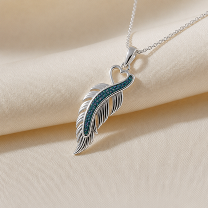 Spica feather memorial pendant in teal mist, handcrafted in Lancashire UK