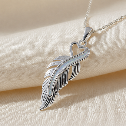 Spica feather memorial pendant in white snow, handcrafted in Lancashire UK
