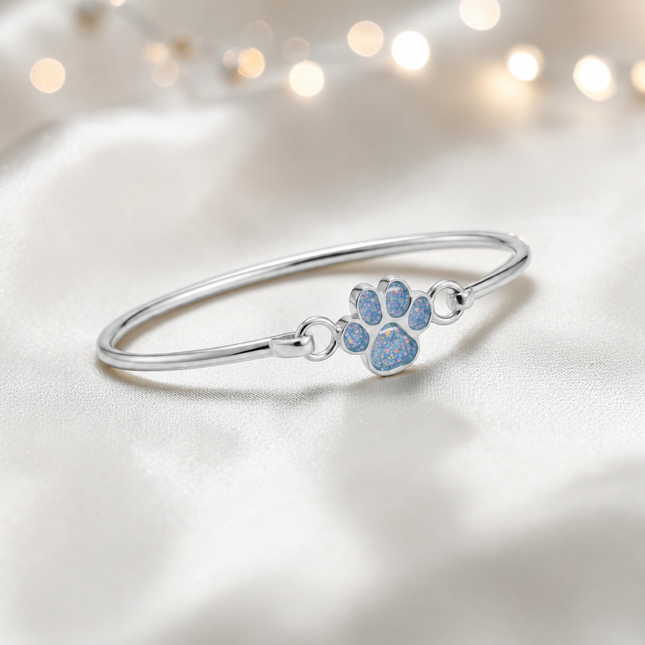 Starlight paw ashes bangle, in baby blue, handcrafted in Lancashire UK - by Keepsake Memorial Jewellery