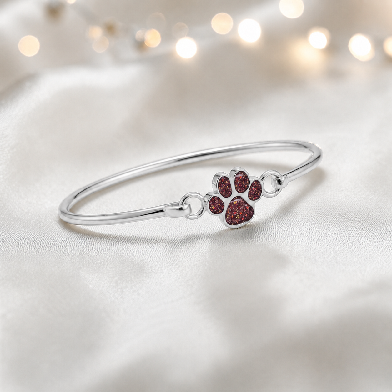 Starlight paw ashes bangle, in ruby red, handcrafted in Lancashire UK - by Keepsake Memorial Jewellery