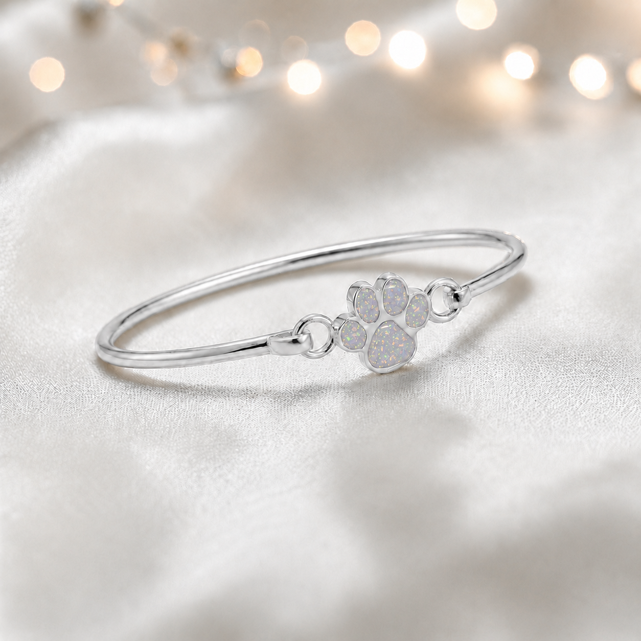 Starlight paw ashes bangle, in white snow, handcrafted in Lancashire UK - by Keepsake Memorial Jewellery