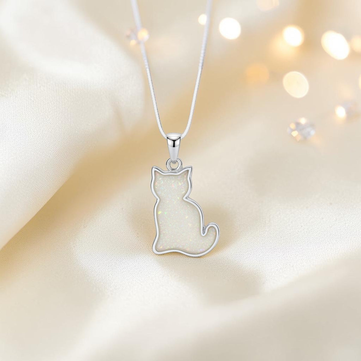 Tabatha Silver cat memorial ashes pendant, in white snow, handcrafted in Lancashire, UK - by Keepsake Memorial Jewellery