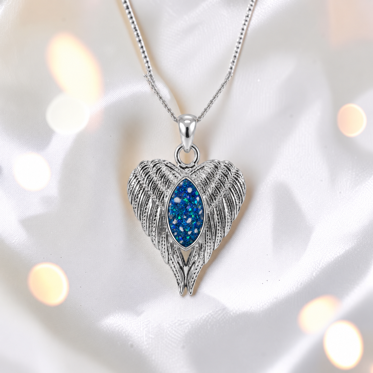 Tayga angel wing heart pendant in sapphire glow, handcrafted in Lancashire UK - by Keepsake Memorial Jewellery