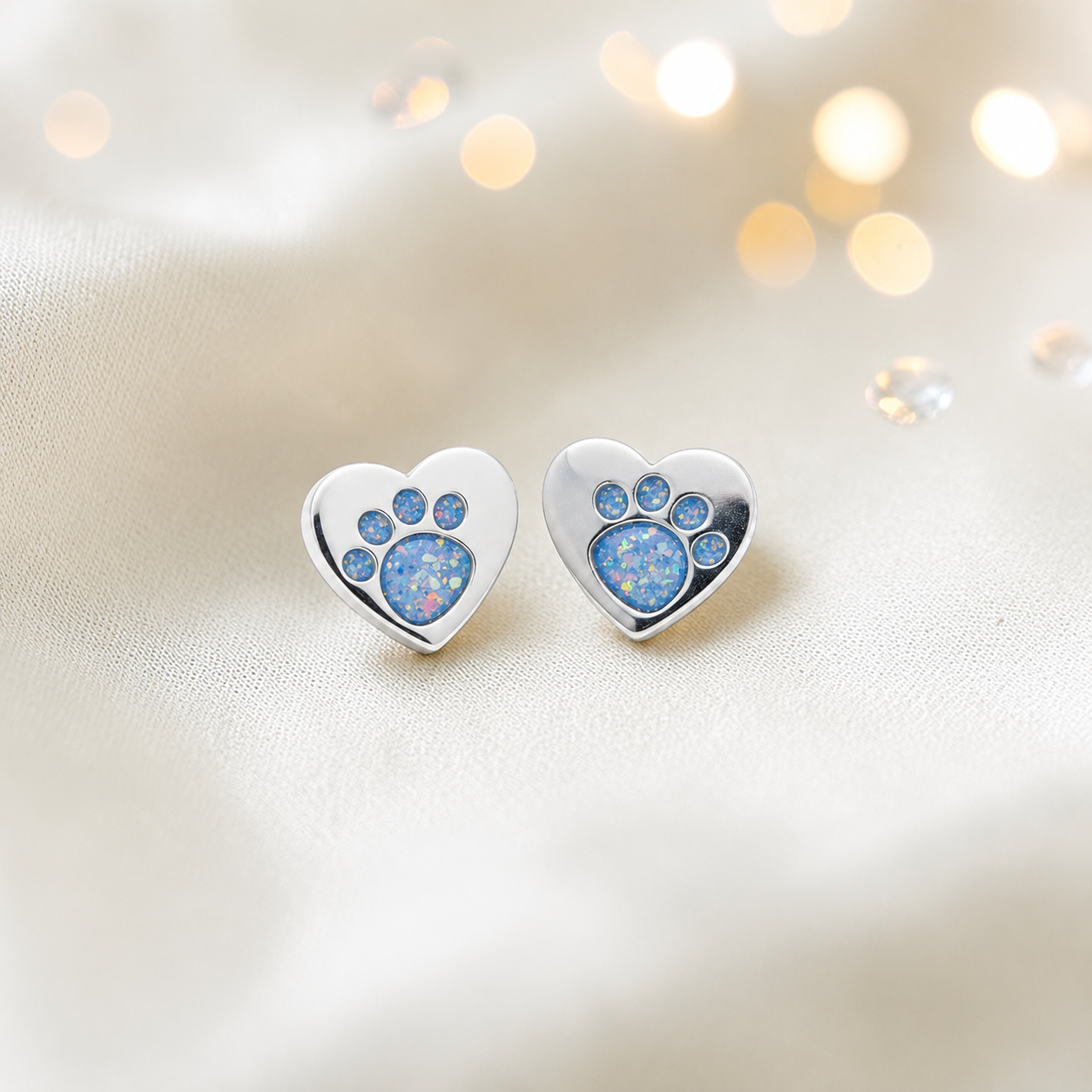 Tilly paw studs — silver heart shaped ashes memorial ear studs in baby blue, handcrafted in Lancashire, UK - by Keepsake Memorial Jewellery