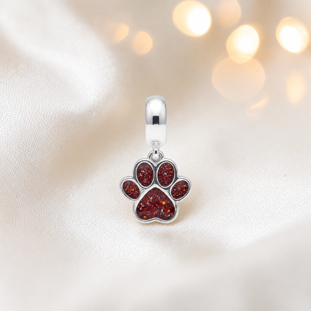 Whiskers dangle paw ashes charm, in ruby red, handcrafted in Lancashire UK - by Keepsake Memorial Jewellery 