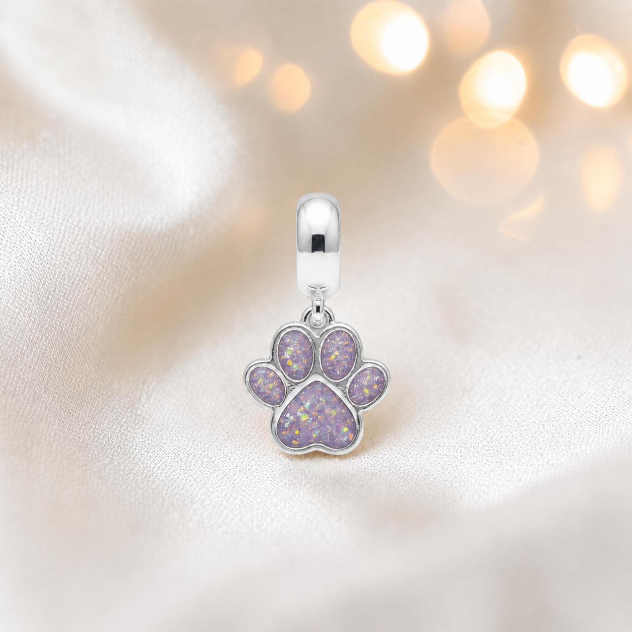 Whiskers dangle paw ashes charm, in unicorn purple, handcrafted in Lancashire UK - by Keepsake Memorial Jewellery 