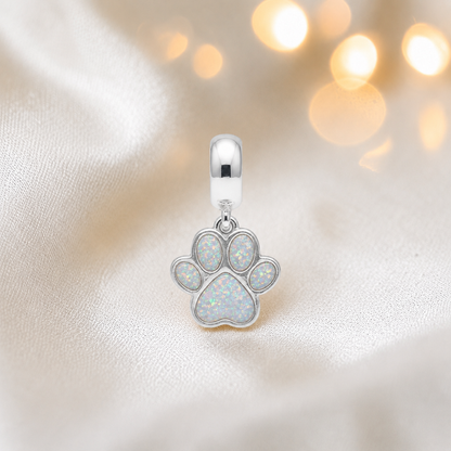 Whiskers dangle paw ashes charm, in white snow, handcrafted in Lancashire UK - by Keepsake Memorial Jewellery 