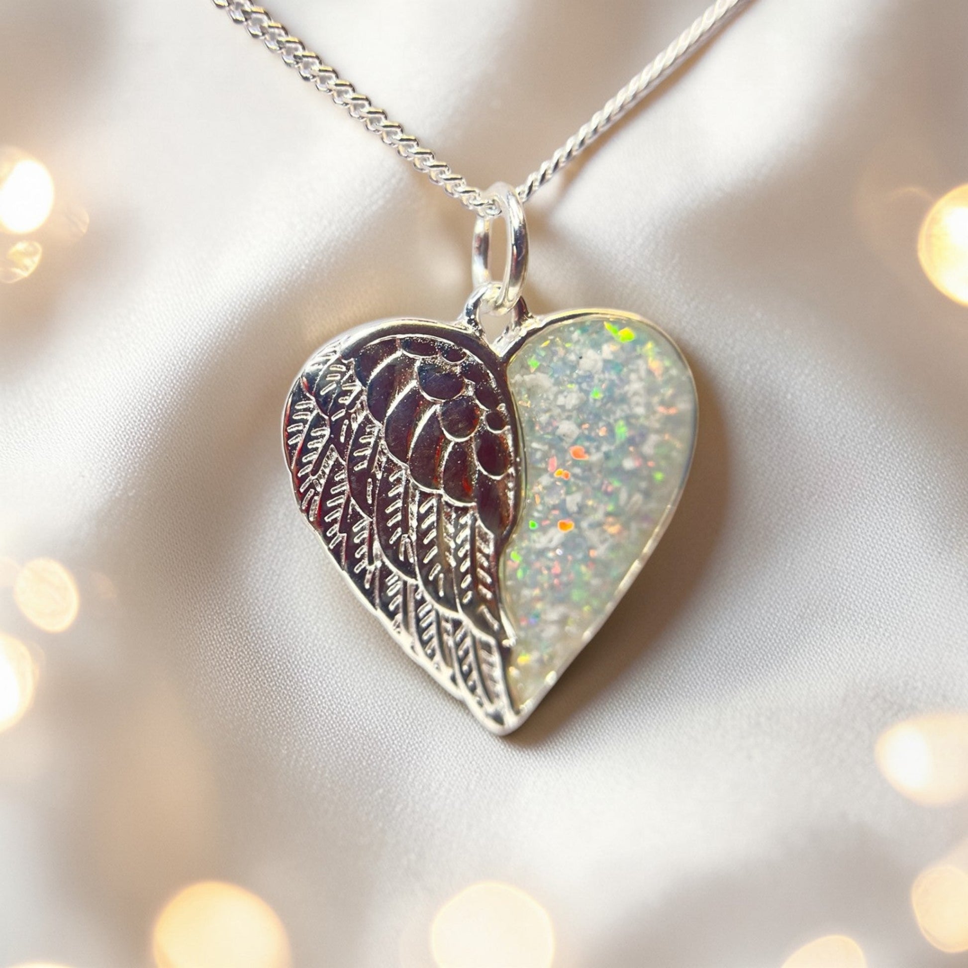 silver angel wing heart memorial pendant, handcrafted in lancashire