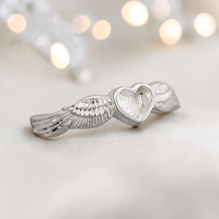 Raphaela Ring — close-up of angel wing detail, sterling silver memorial ring handcrafted in the UK