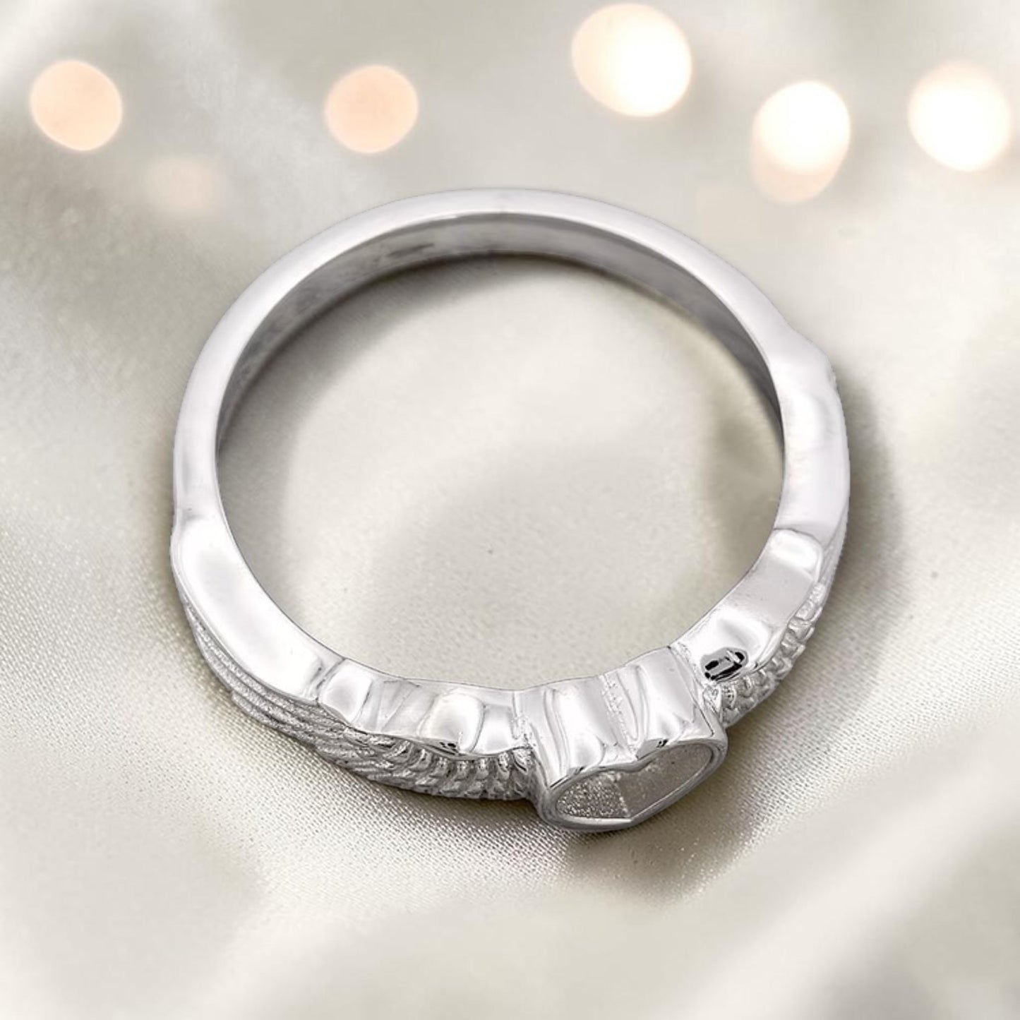 Raphaela Ring — top view of silver angel wing heart memorial ring, handcrafted in Lancashire, UK