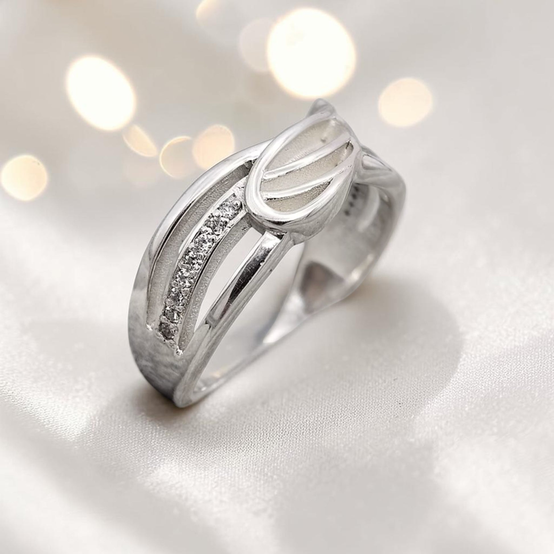 Angelica Ring — sterling silver angel wing memorial ring, handcrafted in Lancashire, UK