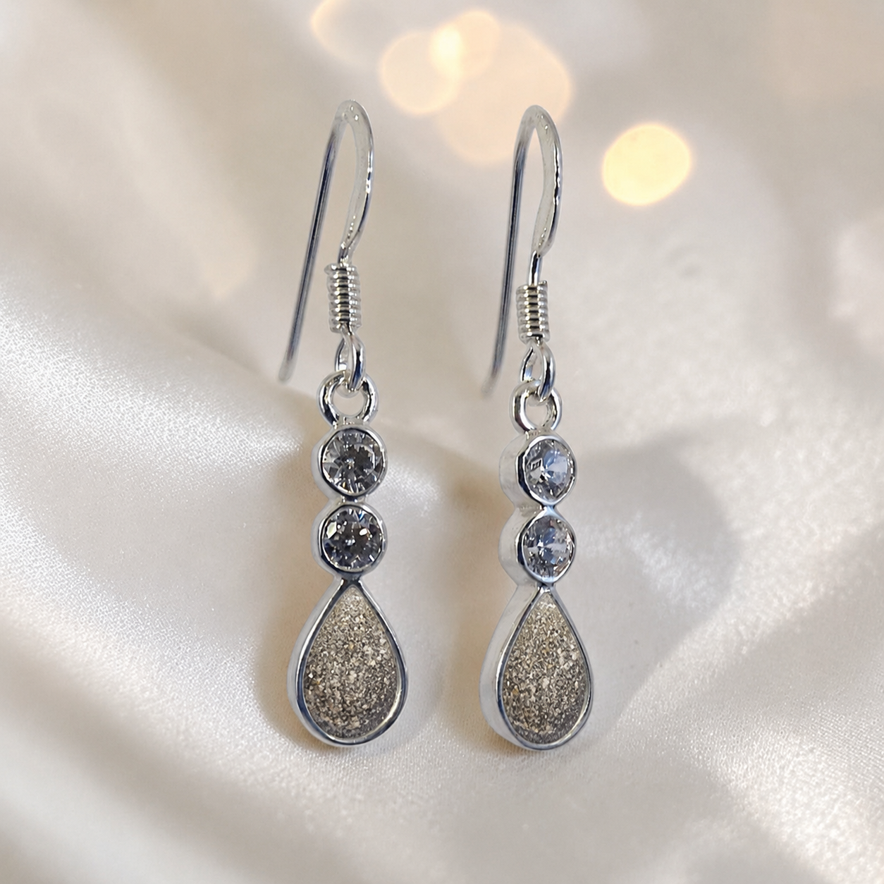 Acrux Earrings — silver pear drop ashes memorial earrings in Gold Olive resin, handcrafted in Lancashire, UK