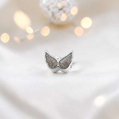 Natural ash sterling silver angel wing ashes memorial charm, handcrafted in Lancashire by keepsake memorial