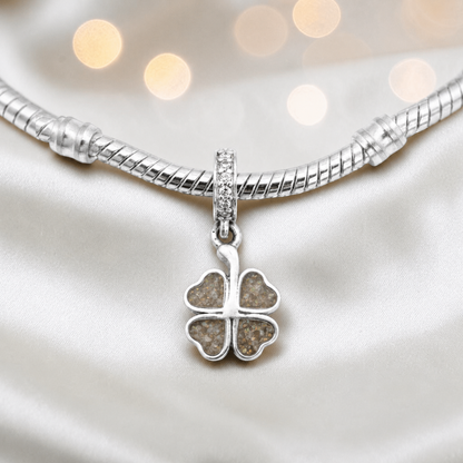 Natural ash sterling silver clover dangle ashes memorial charm, handcrafted in Lancashire by keepsake memorial