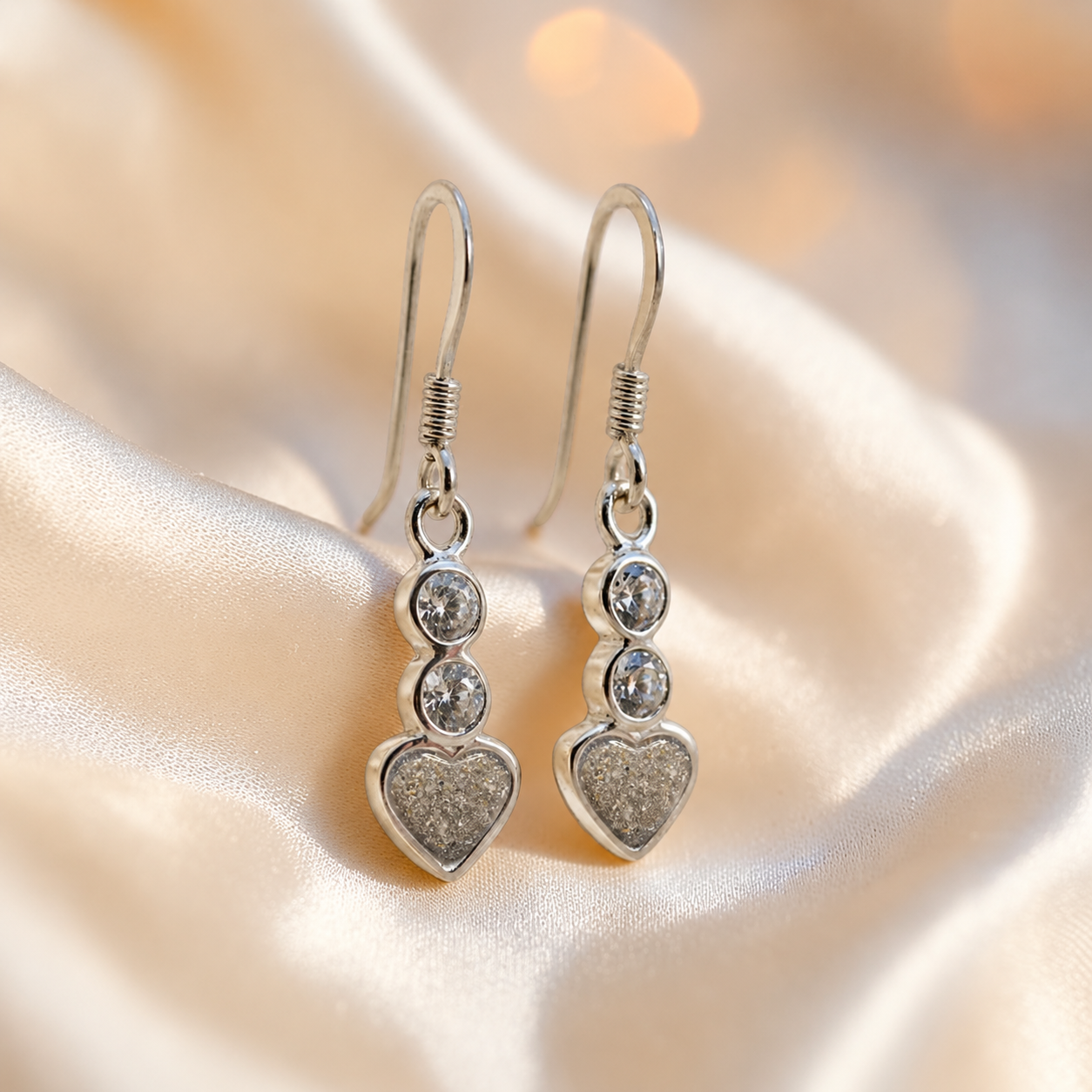 Pleione Earrings — silver heart drop ashes memorial earrings in Natural Ash resin, handcrafted in Lancashire, UK