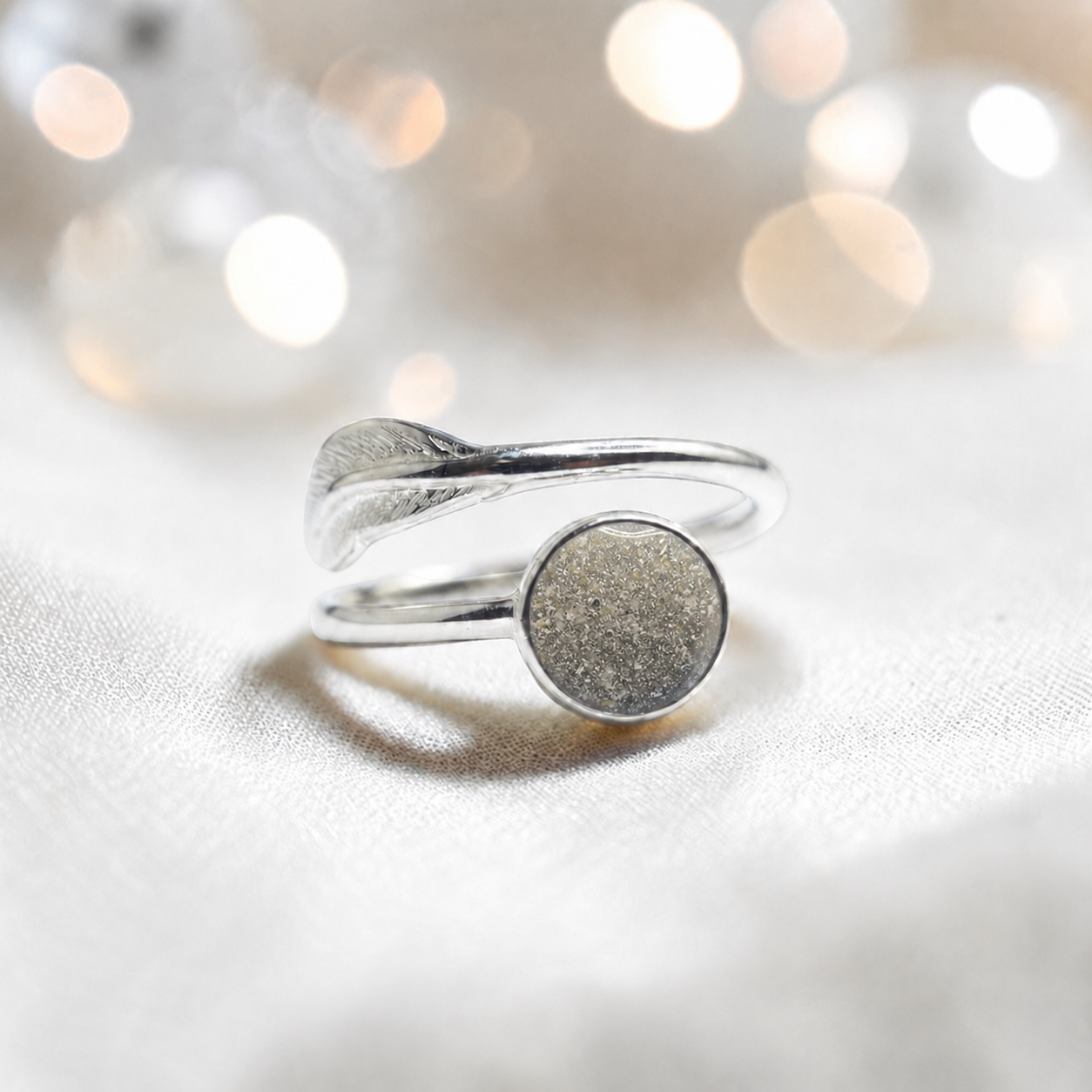 Feather Whisper Ring — silver feather ashes memorial ring, in natural ash, handcrafted in Lancashire, UK