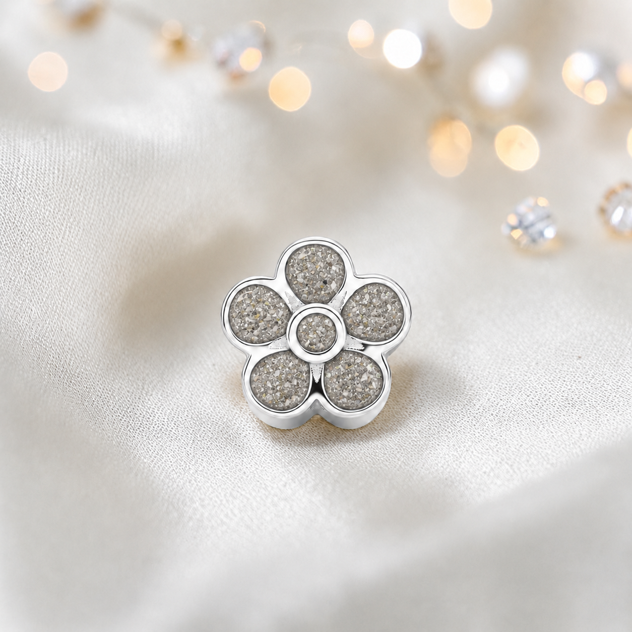 Natural ash sterling silver flora, flower ashes memorial charm, handcrafted in Lancashire by keepsake memorial