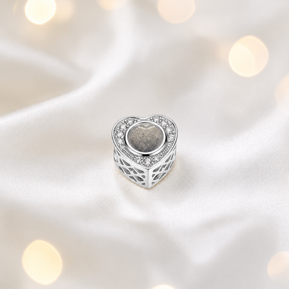 Natural ash sterling silver heart of memories ashes memorial charm, handcrafted in Lancashire by keepsake memorial