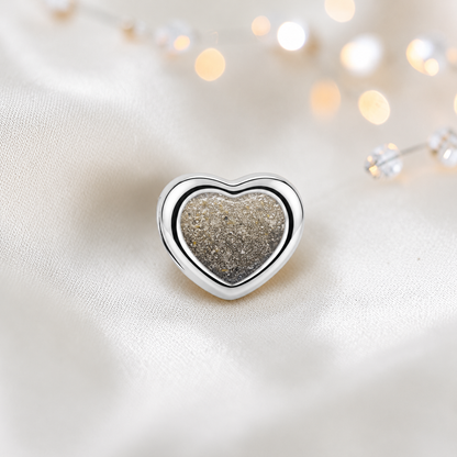 Natural ash sterling silver peaceful heart ashes memorial charm, handcrafted in Lancashire by keepsake memorial