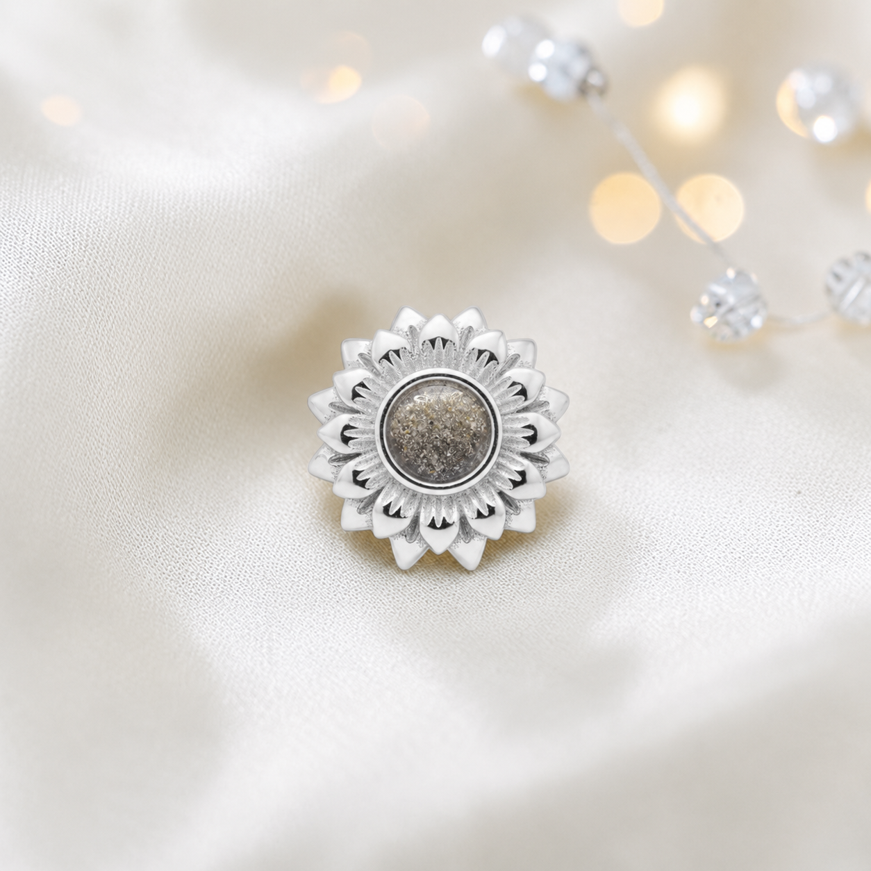 Natural ash sterling silver sunflower ashes memorial charm, handcrafted in Lancashire by keepsake memorial