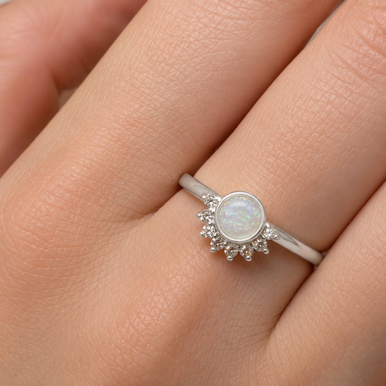 aurora keepsake memorial ring in white snow, on hand, handcrafted in lancashire