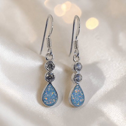 Acrux Earrings — silver pear drop ashes memorial earrings in Baby Blue resin, handcrafted in Lancashire, UK