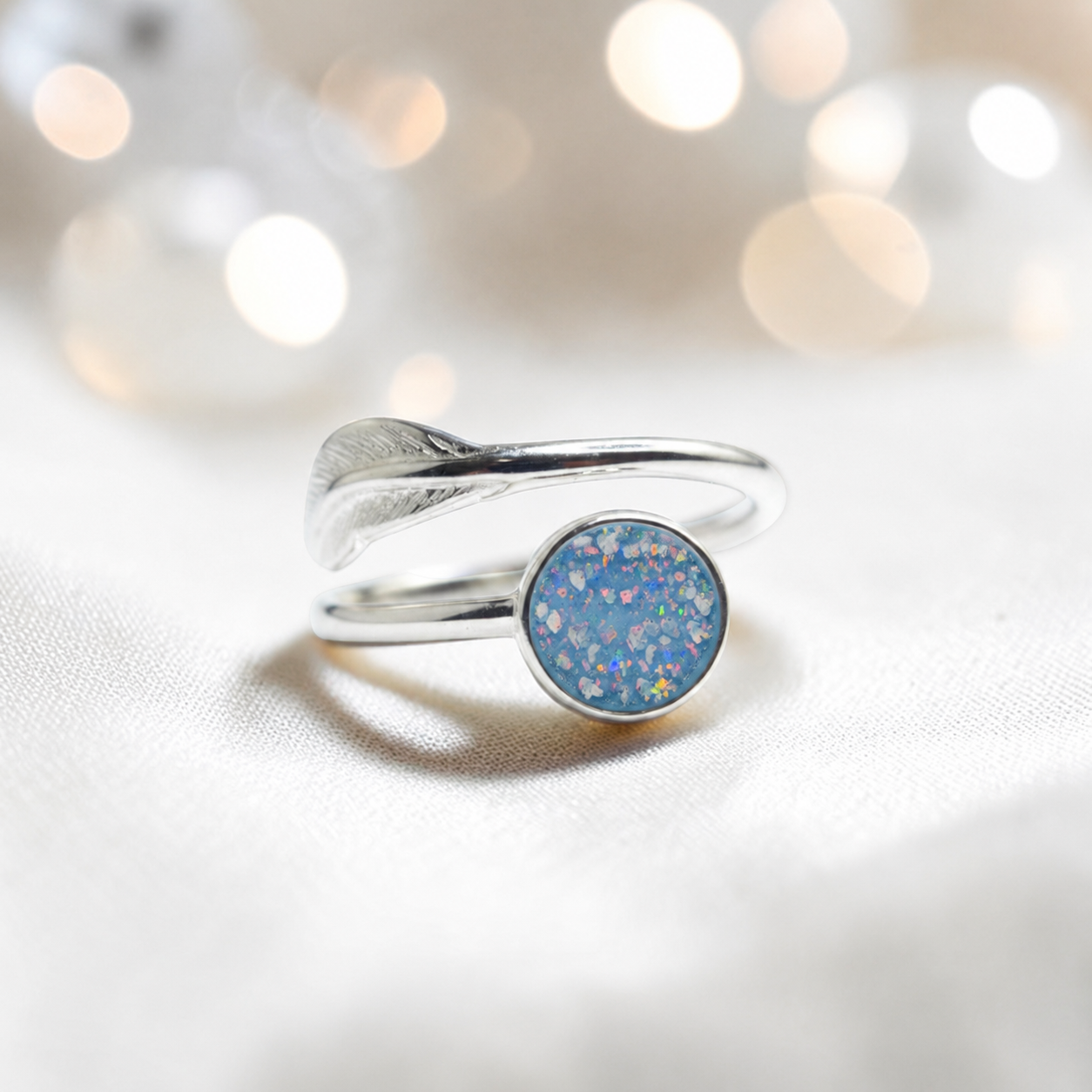 Feather Whisper Ring — silver feather ashes memorial ring, in baby blue, handcrafted in Lancashire, UK